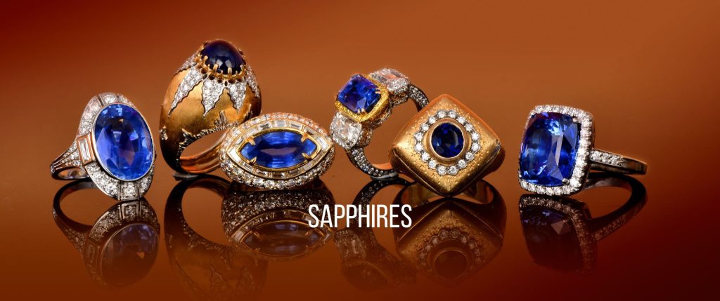 Vintage and estate sapphire gemstone rings from Dover Jewelry, featuring exquisite blue sapphires surrounded by diamonds in various luxurious settings