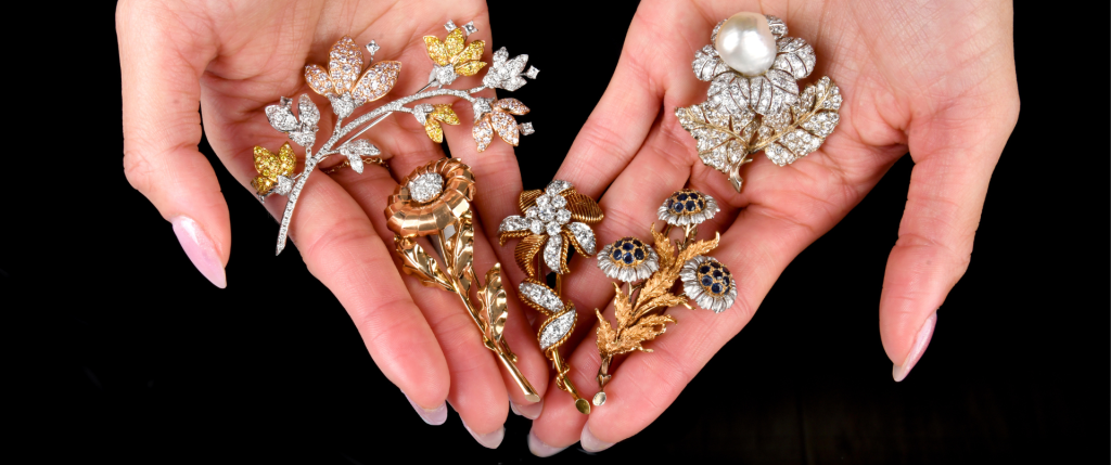 A collection of antique and vintage Buccellati gold, diamond, and rare gemstone brooches available at Dover Jewelry, showcasing intricate craftsmanship and timeless luxury.